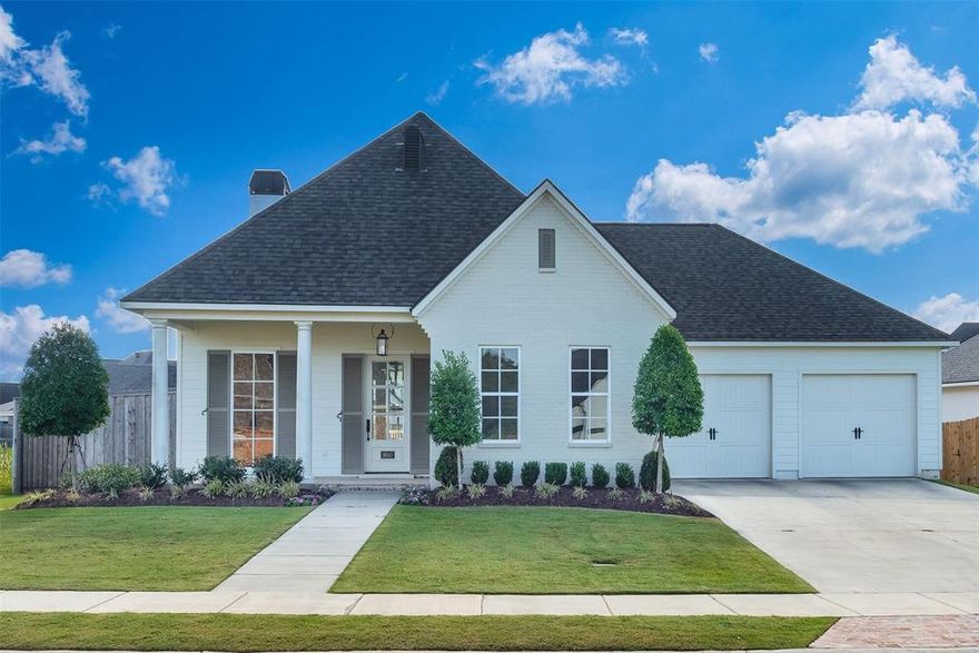 Built in 2022, this like-new home offers modern comfort with timeless Louisiana charm. Located near the neighborhood park in the gated Grove at Garrett Farm community, it features a classic brick-and-siding exterior with a precious front porch that sets a welcoming tone. Inside, the wonderful layout shines. The living room boasts wood floors, a brick fireplace, tall to-the-floor windows, and abundant natural light. The chef’s kitchen is a true highlight with a custom vent hood, GE stainless appliances, gas cooktop, pretty white tile backsplash, and an oversized island with storage, seating, and electrical outlets. The island overlooks the fireplace in the great room, while a flex room off the kitchen makes the perfect den or casual dining space. A front bedroom with access to a full bath offers flexibility for a guest suite or home office. The private master suite is thoughtfully tucked away, featuring a soaking tub, a spacious walk-in shower with bench and oversized subway tile, a double-sink vanity, and a generous walk-in closet. Two additional bedrooms share their own hallway with a convenient full bath between. Everyday living is made easy with a mud bench with storage and hooks off the garage and a utility room with decorative tile and sink. Outdoor enjoyment awaits on the covered back porch overlooking the perfectly sized yard. This home combines style, function, and comfort. Located in The Grove at Garrett Farm, residents enjoy a wonderful lifestyle on 78 peaceful acres along Wallace Lake Road in South Shreveport. This gated community is designed for healthy, connected living, offering walking trails, green spaces, scenic lake views, and more. Don’t miss your chance to own this timeless home in one of Shreveport’s premier communities.