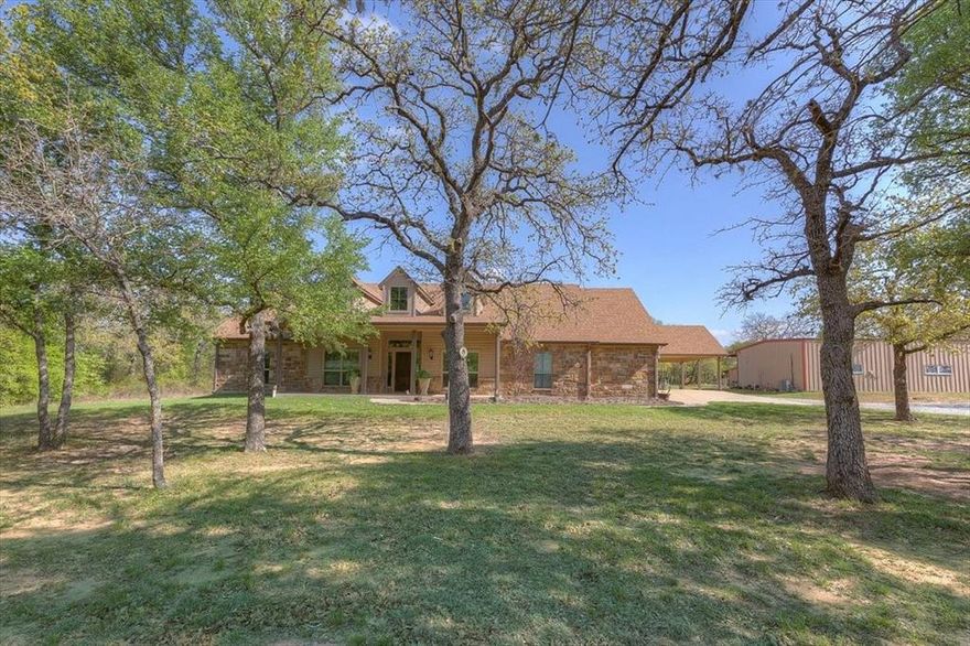 Country living at its BEST....with everything you need and want in BROCK ISD!! 10.29 beautiful, ag exempt acres with a custom designed 3-bedroom home, a 1200 SF guest house and a 20x24 insulated shop with electricity. Bring the kids, the dogs, the horses....and you can even bring the in-laws! The open floor plan of the main house creates a functional home with lots of special touches like hand-scraped wood floors. The kitchen makes entertaining a breeze with a 6-burner gas stove, an oversized eat-at bar, a walk-in pantry, and LOTS of counter space and cabinets. The office includes 2 closets that allow it to be used as a 4th bedroom, if needed. Enjoy the serenity and beauty of the outdoors while you entertain in the outdoor living space with a fireplace, grill, and sink, and there's a perfect spot to install a pool for the kids. Don't need the guest house? Feel free to use it as an income-producing property. A few more extras include 2 RV spots with water and septic hookups, a chicken coop, a lean-to for livestock, spray foam insulation, a pier-reinforced slab, a new hot water heater and a new HVAC handler. And if ALL of these features aren't enough, 25% of the available mineral rights will convey with the sale. There's WAY too much for you to miss out on......come see for yourself!