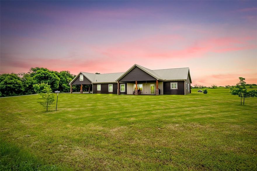 Welcome to the Country! Nestled on over 32 picturesque acres off of a paved road, this spacious ranch-style home offers the perfect blend of peaceful country living and modern convenience. With 5 bedrooms, 3 bathrooms, and large covered porches ideal for enjoying your morning coffee and scenic views, this property has it all. A separate mother-in-law suite with its own bathroom and kitchenette provides privacy for guests or extended family. The fully insulated 36X50 metal workshop with electricity is perfect for storage, hobbies, or your next big project. Enjoy sustainable living with paid-off solar panels, a private electric well, and a backup generator—meaning no utility bills and off-grid potential. With no restrictions and endless possibilities, this property is perfect for a family homestead, hobby farm, or anyone ready to embrace the freedom of wide-open Texas countryside. Don’t miss your chance to own this rare and unrestricted slice of country paradise!