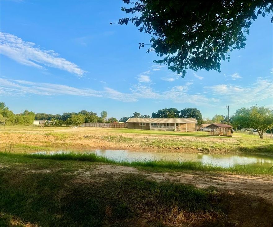 Very well maintained home on almost 1.5 private acres with NO HOA. Many upgrades on this one including metal roof with extended 12' deck coverage, stocked pond, aerobic septic system, tankless water heater and HVAC (2022), vinyl plank throughout -no carpet, newer kitchen appliances, and an abundant amount of storage rarely found! Beautiful kitchen equipped with large island adds storage, work and dining space and is the perfect spot to host family and friends. Spacious living room with gorgeous built ins for style and function. Large primary retreat with ensuite boasting dual vanities and sinks, dual walk in closets, soaking tub and separate shower. Split bedroom floor plan with secondary bedroom on opposite end of home with close access to additional full bath. What was originally a third small bedroom has been transformed into a huge storage space with shelving and plenty of room to house a desk for cozy home office. Another portion of this revitalized space constructed to make a giant walk thru pantry. An additional custom touch on this home is the cedar trim installed throughout the entire home adding beauty to every room and matching the cedar ceiling on outside deck. Enjoy the 12X40 covered deck overlooking the backyard, stocked pond and gazebo. Additional covered area with gravel and pavers provides a great place for equipment, workspace or place to play in the shade. Two separate gated entrances to the back portion of the property allow freedom to access the land as needed with no disruptions. Lovely gazebo situated between the home and pond is the perfect spot for outdoor living! Property is completely fenced and very private. Storm shelter on site is an added safety feature. Two car carport and private driveway. Plenty of room for additional parking and take your pick on an area to build a workshop. Rare opportunity to own a special property in great location and still be within just a few minutes of schools, hospitals, shopping, dining, etc TOUR IT TODAY!