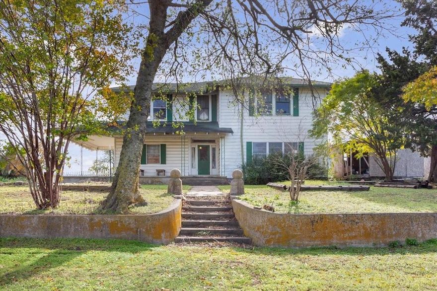 I love listing history.  This vintage 1870, 5 bedroom, 4 bath home has so much potential.  It stands on .69 of an acre and sits on a hilltop overlooking Old Brandon Rd. to the north.  With approx. 3198 sq. feet, this 2 story home has a total of 5 bedrooms and 4 baths.  As you enter into the front living room, you'll notice over 10 foot ceilings throughout the main house along with french doors.  The original wb fireplace is now faux.  The back part of the home has a nice sized, updated kitchen with lots of cabinets, sitting area, along with mud room and utility.  Upstairs, there are 4 large bedrooms with some newer windows and two full baths.  Hardwood floors throughout home.  The electrical was updated in 2000 along with some of the plumbing.  The carport attaches to the home on the rear and there is a large 30 x 40 shop with 10 ft. walls and 220 watt. Beautiful trees . Would make a gorgeous home with some TLC, B&B, or even a commercial investment.