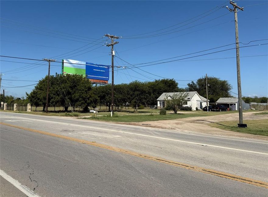 Prime Commercial Location with 1 acre and a 1,444 sqft Home just Outside of Crowley City Limits! With frontage on FM 1187, it offers High Traffic Visibility for a Business. Property is currently used for Residential. The 1963 Home was originally a duplex but has been converted to a single family home. Offering 2 Bedrooms and 2 Living Rooms, 2 Bathrooms and a Full Size Utility Room. It needs updates and repairs, but would work great for an office or rental once renovated. 2 Electric Hook Ups and a Water Meter are already in place; saving the new owner on construction utility impact fees. Back of Property is fenced and Cross Fenced and has been used in the past for livestock. There's also a Metal Barn Workshop with a concrete floor, electric, and an attached 2 Car Covered Carport Owner will look at all offers! Don't pass up this Commercial Opportunity!