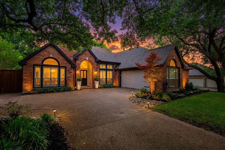 Embrace the classic elegance of this 4-bedroom, 2.5-bathroom home, nestled beneath the canopy of stately oak trees in the highly sought-after Valley Creek neighborhood. This quiet, tree-lined community provides a peaceful retreat while keeping you close to everything McKinney has to offer. Inside, a grand foyer welcomes you into a layout featuring hand-scraped hardwood floors throughout and soaring ceilings. The open-concept living area is flooded with natural light through a stunning wall of windows dressed in custom plantation shutters, all anchored by a traditional gas fireplace with a classic mantel. The kitchen is equipped with custom cabinetry, granite countertops, stainless steel appliances, and a large breakfast nook with a built-in desk.

The primary suite is a true sanctuary, highlighted by a wall of floor-to-ceiling windows overlooking the private back courtyard, a sitting area, and a custom walk-in closet. The classically updated ensuite bath is designed for relaxation, boasting a double shower, a dual-sink stone vanity, and a stunning chandelier centered over a vintage-style clawfoot bathtub. Outside, the home is surrounded by privacy panels, tasteful landscaping and raised garden beds, while the maintenance-free side yard and an open courtyard with a firepit provide versatile spaces for outdoor enjoyment. Residents enjoy HOA access, scenic trails, parks, and a massive greenbelt.

Don't miss the opportunity to secure this quintessential suburban retreat. With its unbeatable proximity to Valley Creek Elementary, Eldorado Country Club and easy access to the 121 corridor, this home offers the perfect balance of community and convenience—schedule your showing today and envision your next chapter here!
