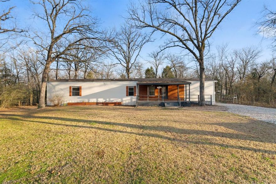 Completely redesigned and rebuilt, this stunning manufactured home sits on two generous 50x150 lots and truly stands out as a work of art. Thoughtfully planned from top to bottom, every inch of the home has been maximized for both comfortable living and smart storage.

The split floor plan features two private en-suite bedrooms located at opposite ends of the home, each offering its own sitting or work area—ideal for guests, remote work, or multigenerational living. The inviting living space is anchored by a striking electric fireplace wall that seamlessly incorporates a TV and dry bar, creating a stylish focal point for relaxing or entertaining. High-grade vinyl plank flooring ties the design together, enhancing the open, cohesive feel throughout.

The kitchen is designed with entertaining in mind, featuring a central island with sink and dishwasher, allowing guests to sit facing the chef. All updates were completed approximately two years ago, including new countertops, cabinetry, and appliances—all of which convey with the home.

Step outside to the 100x150 property, offering space and versatility rarely found. Enjoy four large raised planter boxes ready for spring gardening, a storage shipping container that conveys, and a compost box tucked neatly in the back corner. The covered front deck is wheelchair accessible, and there is ample parking for vehicles, guests, or recreational toys.

With features too numerous to list, this one-of-a-kind property is a must-see—perfect as a weekend retreat or a full-time residence.