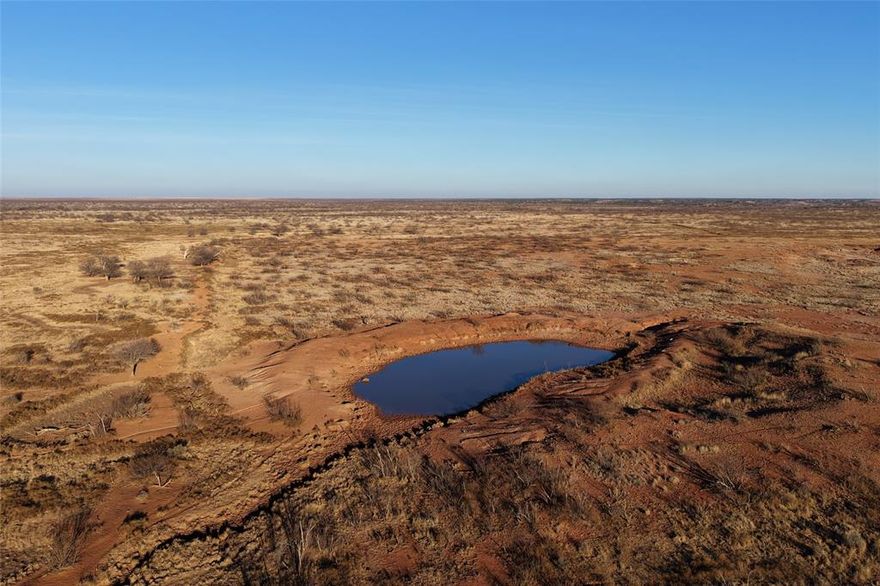 Crump Flat Farm and Ranch is located near Paducah, TX in Cottle County on US 70. 1,136 +or- total acres, with approximately 317 acres planted in cotton and another 80 acres of cultivated land usually planted to wheat or haygrazer.  The balance of acres are improved grasses, with some brush and trees.

Of the 1,136 +or- total acres, the main block of 1,099.7 acres is located six miles east of Paducah with US Highway 70 dividing it; the remaining 33.6 +or- acres are in a separate block and located on the west side of Paducah along the south side of US Highway 70, with part of this land within the city limits of Paducah itself.

The fencing is good to excellent on the perimeter, and fair to good on the interior. There is no fence around the ground planted to cotton.  Rural water is in place, with one earthen tank on the south side of the property. 

The Ranch is surrounded by a large neighbor on three sides and is currently being leased for cattle grazing.  The farming lease and cattle lease can be negotiated to be terminated 30 days after closing, or can be extended if buyer chooses to do so. 

Some minerals will convey 

LIST PRICE: $1,650 per acre