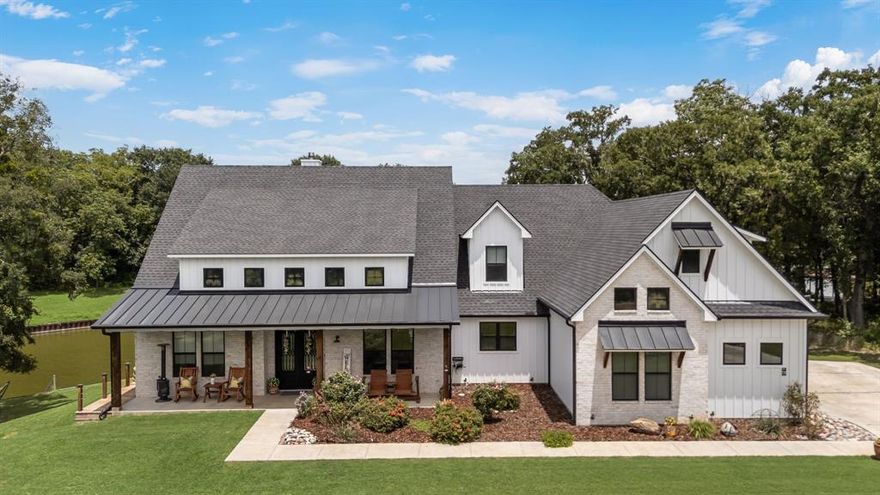 Waterfront Bliss Awaits! Welcome to your slice of lakefront paradise! This stunning 4-bedroom, 3-bath retreat sits on 1.1 acres in one of Richland Chambers’ most coveted communities. With 251 feet of shoreline, a steel retaining wall, and shady mature trees, it’s the perfect blend of beauty and tranquility. Step inside to discover 3,615 sq. ft. of open-concept living, a bonus room, and an oversized 2-car garage. The screened-in back patio with a fireplace is made for evenings under the stars, while the 15' x 8' Master Swim Spa promises year-round fun and relaxation. Hosting friends or family? A private, ADA-compliant mother-in-law suite with kitchenette gives guests comfort and independence. And the perks don’t stop there, this neighborhood feels like a resort with an infinity-edge pool, clubhouse, fitness center, fishing pond with dock, marina, and boat ramp. Just minutes from open water, Richland Chambers (Texas’ 3rd largest lake!) is a fisherman’s dream and a boater’s paradise. Whether you’re looking for peaceful mornings by the water, lively weekends with friends, or simply a forever home with lake views at every turn, this property delivers it all. Upscale lake living has never looked so good!