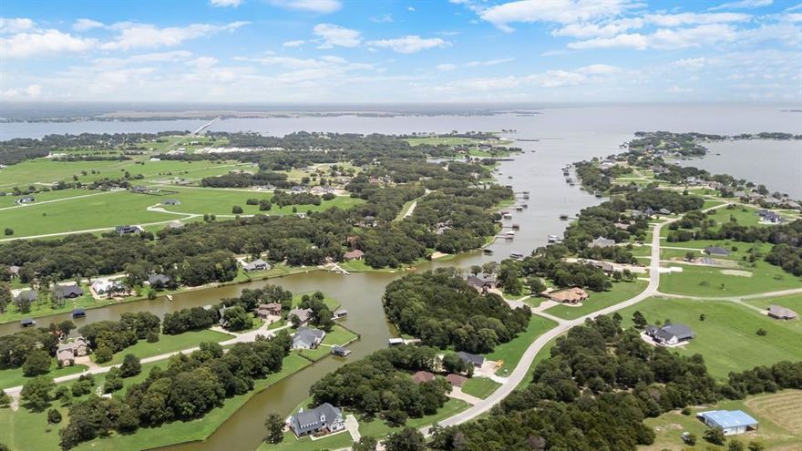 Waterfront Bliss Awaits! Welcome to your slice of lakefront paradise! This stunning 4-bedroom, 3-bath retreat sits on 1.1 acres in one of Richland Chambers’ most coveted communities. With 251 feet of shoreline, a steel retaining wall, and shady mature trees, it’s the perfect blend of beauty and tranquility. Step inside to discover 3,615 sq. ft. of open-concept living, a bonus room, and an oversized 2-car garage. The screened-in back patio with a fireplace is made for evenings under the stars, while the 15' x 8' Master Swim Spa promises year-round fun and relaxation. Hosting friends or family? A private, ADA-compliant mother-in-law suite with kitchenette gives guests comfort and independence. And the perks don’t stop there, this neighborhood feels like a resort with an infinity-edge pool, clubhouse, fitness center, fishing pond with dock, marina, and boat ramp. Just minutes from open water, Richland Chambers (Texas’ 3rd largest lake!) is a fisherman’s dream and a boater’s paradise. Whether you’re looking for peaceful mornings by the water, lively weekends with friends, or simply a forever home with lake views at every turn, this property delivers it all. Upscale lake living has never looked so good!