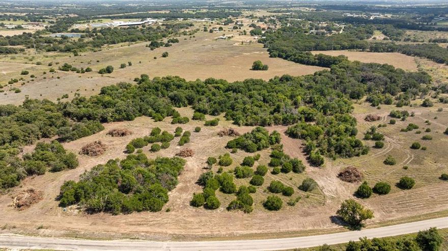 LOT 3 is 2.013 acres & could be increased in size at the back end of the property. This Lot 3 has a brand new just installed Well. Power is being brought along County Road for future access as an included feature. All Lots are 2-3 acres Tracts. Great Location on Paved Road outside City Limits. This is a great opportunity to Build your perfect Dream Home in a great area just outside of town. Additional Lot MLS 21060332, 21060626, 21060753, 21060726, 21060730, 2106043, 21060446,21060764, 21060786 Buyer will be required to get a new Survey