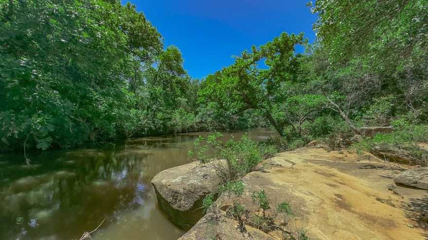 MINERALS CONVEY TO THE BUYER on this 286 acre ranch that has it ALL!  With approximately 40 percent of the ranch being open with both improved and lush native grasses sprinkled with wildflowers. The balance of the property is covered with old growth, mature Post Oaks, Live Oaks, Pecan, Birch, Cedar Elm, Hackberry and Mesquite Trees. This picturesque ranch has live water frontage on both sides of the legendary Keechi Creek. The ranch is cross fenced into thirds and there are three separate stocked ponds that make great for fishing and each share separate paddocks with loamy type soils for rotational grazing.  There are several remarkable build sites for a dream home or retirement destination. Currently the ranch supports recreational activities year round for family and friends and there is currently a herd of appx. 30 Registered Texas Longhorns. its a Hunters Paradise with plentiful of Whitetail Deer, Turkey, Dove and seasonal Quail and Ducks but don't forget about them varmints such as Hogs, Coyote, Fox and occasionally seen Mtn. Lion. The Sellers do own mineral rights and would entertain conveying one-half of their minerals. This could be an excellent investment property being one hour from Ft. Worth and situated on an FM Highway with 3 phase power. Water well data in the immediate area shows to be solid with several strong water wells ranging from 10 to 25 gallon per minute. 

This Ranch is a Must See and one of the prettiest ranches currently on the Market.