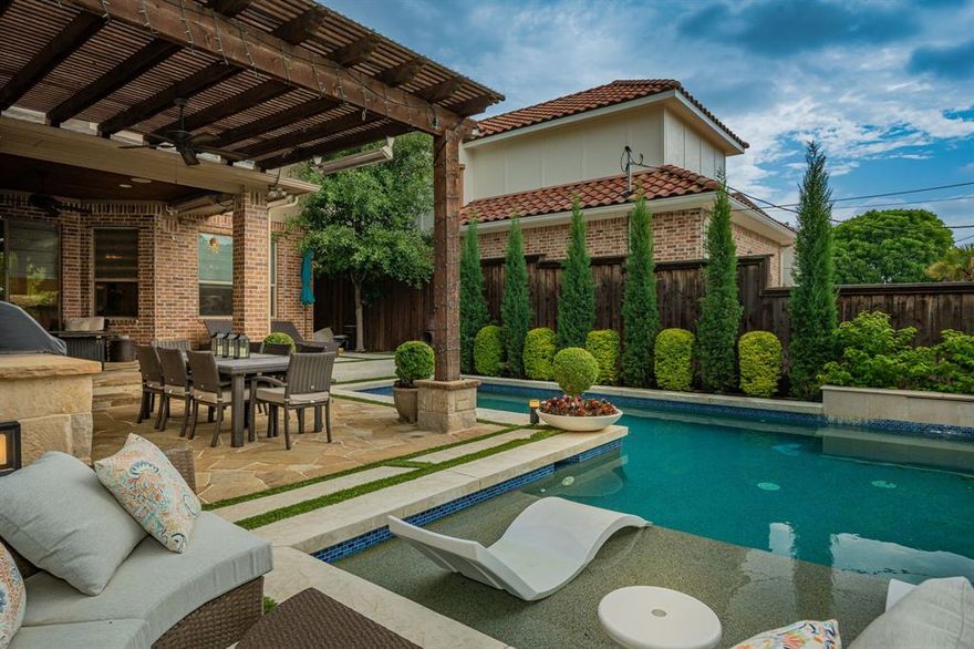 Immerse in Lakewood luxury! This stunning home, in Dallas' coveted Lakewood neighborhood, offers the ultimate upscale lifestyle. Within walking distance of Lakewood Elementary, the location can't be beat.  Perfect for entertaining, this home features a wine cellar, wet bar, game room, and media room.  The gourmet kitchen boasts top of the line appliances, vast counter space, large island, butler's pantry, and a walk-in pantry.  A grand stone fireplace graces the living room with soaring ceilings.  The primary suite is a haven with a spa-like bathroom and generous walk-in closet.  Step into the backyard oasis with an outdoor kitchen, fireplace, and heaters, for those cool evenings.  The beautiful newly built ozone pool is not only heated, but also has a chiller to ensure year-round enjoyment.  Th electric driveway gate ensures privacy. Don't miss this remarkable Lakewood gem!