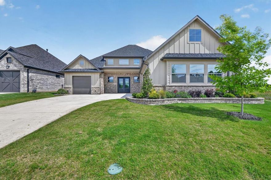 Beautiful home in highly desirable Thomas Crossing community, perfectly positioned on the 11th green of Southern Oaks Golf Course & offering breathtaking views stretching from the 11th tee box to the 12th green. Enjoy peaceful mornings & relaxing evenings from your private balcony overlooking the course—this is golf course living at its finest.This thoughtfully designed home features 3 spacious bedrooms, 3 full baths, a 2-car garage, & an additional golf cart garage for added convenience. From the moment you step inside, you’re welcomed by open-concept layout filled with natural light from expansive windows, creating a bright & inviting atmosphere throughout.The living room is the heart of the home, showcasing a cozy gas log fireplace, beautiful wood beams, & luxury vinyl plank flooring that adds both style & durability. The seamless flow into the kitchen makes this space perfect for everyday living & entertaining alike. Kitchen is true chef’s delight, offering Shaker-style cabinetry, quartz countertops, a large center island with plenty of seating, & ample prep & storage space. Adjacent dining area is perfectly positioned to capture stunning golf course views, making every meal feel special. Private primary suite serves as relaxing retreat, complete with a spa-like ensuite featuring a soaking tub, separate shower, dual sinks, & a spacious walk-in closet. Additional bedroom & full bath downstairs provide flexibility for guests or a home office. Upstairs, you’ll find a versatile second living area or game room, along with another bedroom & full bath. Step out onto the balcony & take in sweeping views of the course—perfect for unwinding after a long day or entertaining guests. Additional features include full foam encapsulation for enhanced energy efficiency, custom landscaping, sprinkler system, gutters, & numerous upgrades throughout.This home offers the perfect blend of comfort, style, & unbeatable golf course views—don’t miss your opportunity to make it yours!