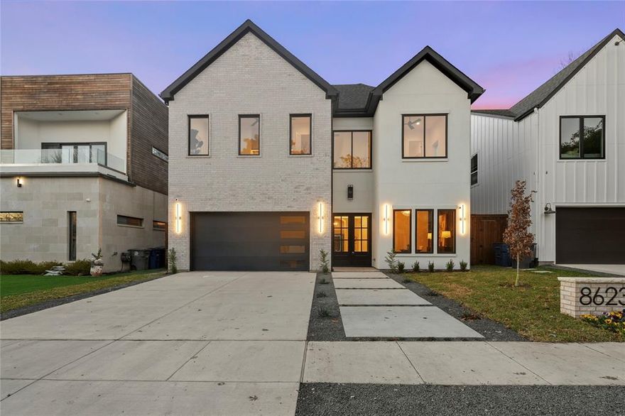 Ideally located in the Forest Hills neighborhood just moments from White Rock Lake, this exceptional home offers 4 bedrooms, 4.5 bathrooms, a private office, and a dedicated game room or theater. Striking curb appeal sets the tone for the modern finishes found throughout the home. The gourmet kitchen features custom cabinetry, an oversized island quartzite countertops, premium Monogram appliances, a gas range, and a massive walk-in pantry ideal for entertaining and everyday living. The living room showcases soaring ceilings, abundant natural light, a stunning cast stone mantel, and an indoor gas fireplace. The outdoor living area is equally impressive with a gas fireplace and patio speakers, creating the perfect setting for gatherings. Additional audio features include theater and outdoor patio speakers, along with pre-wiring in the living room and primary suite for future sound system upgrades. The primary suite is conveniently located on the main level and offers a luxurious ensuite and an expansive walk-in closet. Each additional bedroom provides plenty of space and privacy. The home also includes a 3-camera security system, a full sprinkler system, professionally landscaped grounds with French drains around the perimeter of the home, and an 8-foot privacy fence enclosing the spacious backyard. Conveniently located near restaurants with easy access to major highways and roads, this home offers both comfort and convenience.