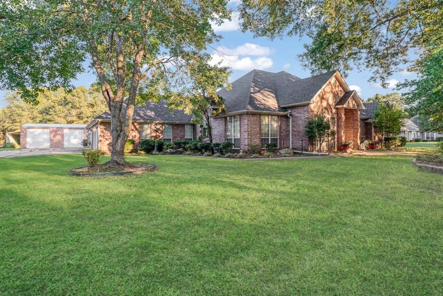 This spacious single-story home sits on 2.8 beautifully landscaped acres in the desirable Beaver Creek addition, just five miles north of Paris. The floorplan centers on an open living-dining-sunroom area, wood burning fireplace, soaring 12-foot ceilings and elegant crown moldings, creating an inviting space for everyday living and entertaining. A cozy family room with a gas-log fireplace offers a comfortable retreat. The chef-ready kitchen features granite countertops, a breakfast bar, a work island, custom cabinetry with a built-in china cabinet, and ample prep space. Four roomy bedrooms and three full baths provide privacy and convenience for family and guests. Oversized laundry with washer and dryer included; space for a freezer or second fridge; additional walk-in pantry for bulk storage! 4 car garage +30x40 metal shop, +boat carport. Inground vinyl pool (not currently in working order) and large yard perfect for entertaining or hobby farming, and storm shelter for safety and peace of mind.