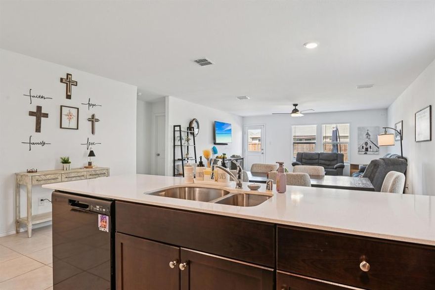 WOW, Awesome, and Charming Home Ideally located just off Sycamore and Chisholm Trail. This beautifully maintained home is nestled in a desirable neighborhood within walking distance of the community pool and playground—offering the perfect blend of convenience and lifestyle. Step inside to an inviting entry that opens into a bright, spacious interior, thoughtfully designed to maximize its 1,515 square feet. The open-concept layout seamlessly connects the kitchen, living, and dining areas—creating an ideal space for both everyday living and effortless entertainment. The split-bedroom floor plan provides added privacy, featuring three generously sized bedrooms, two full baths, and a dedicated utility room for everyday ease. Enjoy tile flooring throughout, no carpet, delivering a clean, modern look with durability and low maintenance. Recent Updates & Enhancements Include: Ceiling fans with remote controls in the living area and all bedrooms, Expanded 16x10 patio—perfect for outdoor gatherings, Towel racks added in each bathroom, Additional storage cabinet in the primary bath,  Garage hanging bar for tools and organization, Garage door opener with smartphone access, Backyard security camera system through ADT Smart Home, Smart thermostat with mobile control. Step outside to your extended patio—ideal for relaxing evenings, weekend barbecues, and enjoying your outdoor space. With its thoughtful updates, functional design, and unbeatable location, this home truly checks all the