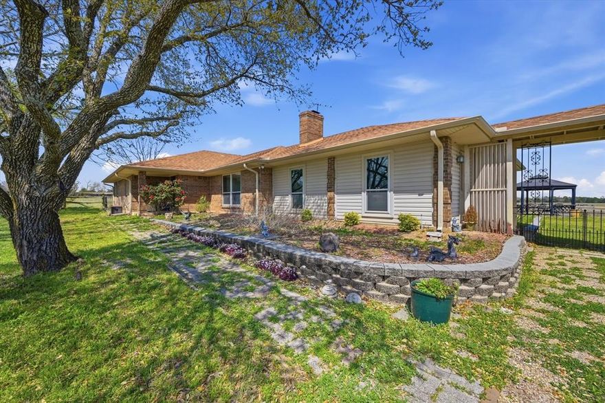 62.65 acres in Collin County with four ponds, open pasture, and a well-positioned ranch-style home, located between Blue Ridge and Farmersville along Highway 78. The property is AG exempt and features rolling terrain, fenced and cross-fenced sections, and multiple water sources, supporting livestock, recreation, or long-term land investment.

The residence offers approximately 3,004 square feet with three bedrooms, two bathrooms, and a flexible layout designed for both everyday living and entertaining. The interior includes a spacious living room that opens into the kitchen and dining area, along with an oversized family room that provides additional gathering space, workspace potential, or recreational use.

The kitchen is equipped with an island, extensive cabinetry, and direct views of the surrounding land, creating a central hub for the home. The primary suite is generously sized and positioned for privacy, with multiple closets and an en-suite bath. Secondary bedrooms are well-proportioned and supported by additional full bath space.

A detached two-car garage and a 30x40 workshop with electricity and concrete flooring provide functional support for equipment, storage, or projects tied to the property.

Utilities include rural water, septic system, and co-op electric, with county road frontage and access approximately 0.2 miles from Highway 78. The land is unzoned, offering flexibility for agricultural use, residential living, or future development. Pipeline easements are present.

Located in a growth corridor of Collin County near the planned Outer Loop, the property offers a balance of usable land, existing improvements, and regional access, with Blue Ridge approximately 4 miles away, Farmersville approximately 6 miles away, and McKinney approximately 20 miles away.

Schedule a private tour to walk the land and experience how the home and acreage come together.