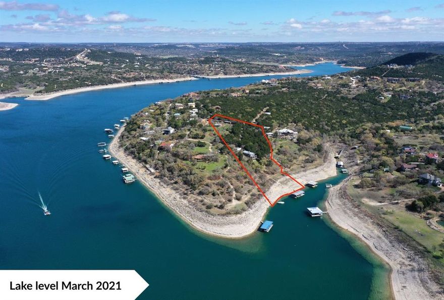 Rare opportunity to own an exceptional 5 plus or minus acres Lake Travis waterfront estate in Volente’s Sandy Shores, boasting 280 plus or minus feet of deep-water frontage along the main body and a deep-water cove of Lake Travis. Additional acreage is available, see Agent for more details. With minimal floodplain, breathtaking views, and a level build site, this property is primed for a dream estate, family compound, or potential development (Buyer to verify). The property features beautiful trees, a landscaped setting, and has easy walkable or drivable access to the waterfront. Lake Travis, renowned for its pristine beauty and crystal-clear waters, stands as one of Texas's most picturesque lakes within the Highland Lakes chain. It is one of the largest, cleanest lakes in central Texas and stretches 64 miles long. Even at its lowest levels, Lake Travis offers four times the navigable water of Lake Austin, while at full capacity, it provides an astounding tenfold increase, all with notably lighter boat traffic. Situated on the property is a primary residence featuring three bedrooms and two bathrooms, offering a spacious and comfortable living space with a cozy fireplace. The home is currently used for short-term rentals. Water is sourced from the lake to service the property. Excellent schools including Vandegrift High School. Located just 10 minutes from 620-2222 and major shopping, dining, and entertainment in Cedar Park, with downtown Austin only 35 minutes away, this property is lakefront living at its finest—an unmatched opportunity to create an extraordinary retreat.