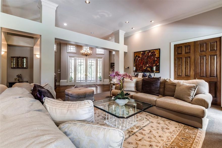 Beautiful home on 1+ acre tract fronting Winnwood Rd. Sloping back to White Rock Creek Walking Path and White Rock Creek with beautiful Veranda as part of home with of large woods and rolling terrains. Veranda has French or sliding glass doors access from master suite, library living room and kitchen-breakfast area-den.