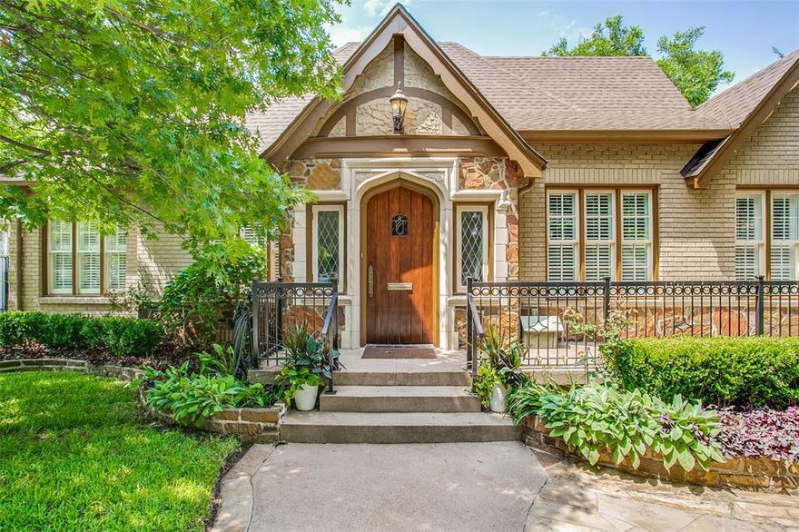 1932 architecturally significant Tudor-style home on French Streets. Short walk to fine dining, the best shopping in Dallas, Highland Park Village & multiple parks. Upon entering this period relevant home, details are immediately revealed with high coved ceilings featuring exposed wood worked beams, windows with leaded diamond shape, arched doorways, stained glass, wood floors and beautiful fireplace converted to gas. Large den is perfect for entertaining has bar & ice machine fort making perfect cocktails. Large chefs kitchen has granite countertops, butcher block island, Sub-Zero, Viking cook top, dual stoves and warming drawer. Kitchen looks out to back yard and has easy access to the back patio. Master is down and overlooks back yard, attached bath has natural stone and dual vanities. 2 large bedrooms up and game room separating for ultimate privacy. 2 car garage has separate entrance to guest quarters. Lots of storage! Lush & established landscape shows this timeless beauty.