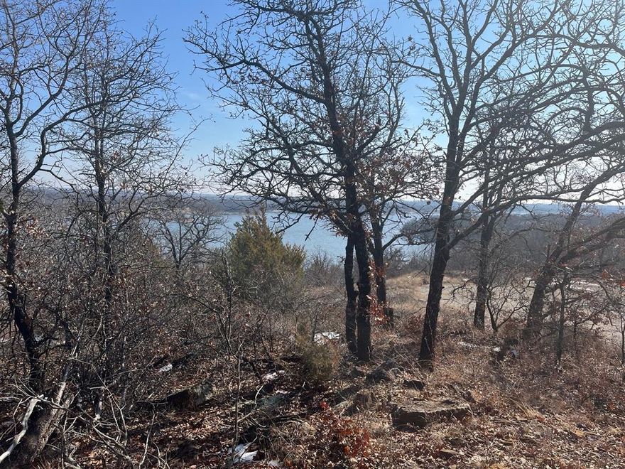 These 2 waterfront lots are a nature lovers retreat, it is heavily treed with large natural rock formations that slopes down to the water of Amon G Carter Lake, which is known for great fishing.  Affordable waterfront lots are hard to find so do not let this opportunity pass you by.