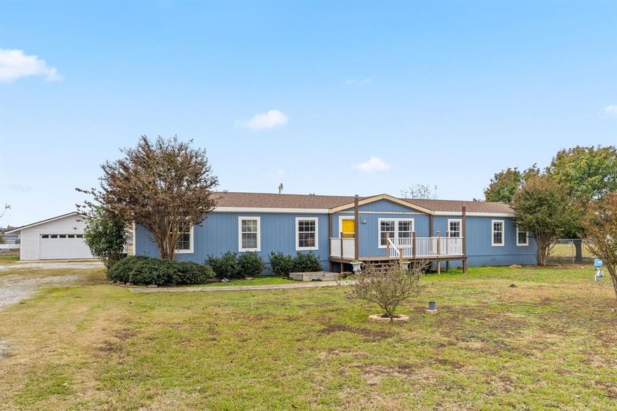 Updated home set on a ONE ACRE LOT with NO HOA that offers peaceful Texas living with room to spread out and enjoy the outdoors. With both the roof and exterior siding recently replaced and fresh paint inside and out, this property blends comfort, charm, and confidence for your next chapter. The large back porch overlooking the expansive yard creates the perfect setting for gatherings, relaxation, and quiet evenings at home. Inside, the home offers a warm and inviting feel with two living areas that provide flexibility for entertaining, working from home, or simply creating separate spaces for everyday living. Thoughtful updates, generous natural light, and an easy flowing layout make the interior feel comfortable from the moment you step inside. The fenced backyard adds both convenience and peace of mind, while well water serves the sprinkler system in the front and part of the backyard, helping maintain the property with ease. An oversized detached garage+workshop provides the versatility so many desire for storage, hobbies, or weekend projects. In addition, a long driveway offers plenty of parking including ample space for RVs. Enjoy quick access to HWY 380, Lake Lavon, plus local shops & dining. Don't miss this opportunity to enjoy space, comfort, and country serenity while still being within reach of local conveniences.