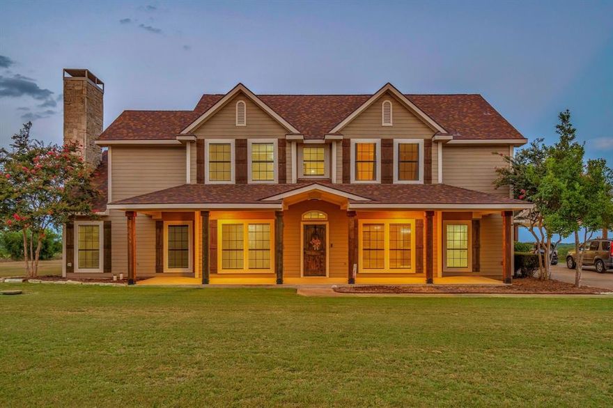 Rare Opportunity to own land on historic site of Superconducting Supercollider! This gated, 12.51 acre, prairie-style ranchette boasts 10 acres of Coastal bermuda w 14x60 shop & 3522 sq ft custom home on 2.5 acre homestead. Enjoy watching private planes take off & land at Midway Regional Airport or drink in the magnificent sunsets & brilliant starry sky on the extended front porch. Springtime surprises with a blanket of bluebonnets & Indian paintbrush. Rustic, cedar pillars & solid Knotty Alder door invite you inside. Stained, glass-paneled, French doors lead to the handsome office with access to the primary suite. Expansive two-story living area w vaulted ceiling & Austin stone gas-log fireplace-an entertainers' delight! Wood flooring in living, dining and entry. Commercial kitchen impresses with Imperial stainless steel, gas, 6-burner stove, 24x24 griddle & 2-36 in. full-sheet ovens and custom, commercial vent-a-hood. Custom solid wood cabinets, & commercial frig, too. Massive commissary or craft room off kitchen. Snuggle up to the flicker of the 2nd stone fireplace in the primary suite. Ensuite bath has been recently renovated w freestanding soaking tub w waterfall faucet, solid wood vanities w Carrara marble countertops, ceramic, apron sink & walk-in shower. Utility boasts extensive upper & lower cabinets, sink, bonus counter prep space, & ice machine! Built-in ironing board & electric or gas dryer hook up, too!
Three generous secondary bdrms enjoy attached bath & ceiling fans. Substantial flex room includes built-in desk, fan, and cabinets.
1460 sq ft insulated shop w steel frame construction & 12 in. slab, 2 entry-bay doors w add'l interior bay door to create 20 ft section. Full electrical, overhead lighting. Stubbed for water in the 20 ft section. 2 hose reels. Compressor mounted on slab behind building. Four-rail pipe fence, swing gate entry & remotes. Perimeter fencing is barbed wire. 40-yr, inpact resistant fiberglass reinforced comp shingles.