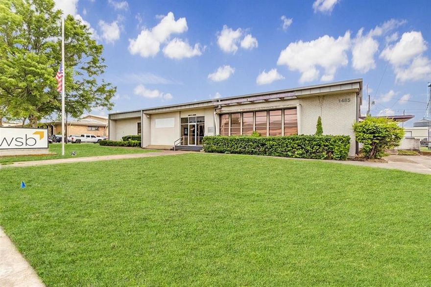 This property presents over 11,000 square feet of exceptional opportunity, situated on a 1.25-acre corner lot that was formerly the headquarters of Lamar Electric Co-op. Its design accommodates a variety of operational needs and uses. Located along North Main, a four-lane major thoroughfare in Paris, Texas, the site benefits from excellent accessibility, visibility, and exposure.
The main area features a diverse array of office spaces, a reception area, a break room, a conference room, and a secure safe room housed within a concrete vault. At the rear of the building, there is currently a workshop with 12-foot ceilings, shipping and handling docks, as well as a laboratory for an engineering firm. The facility includes five bay doors, both inside and outside docks, and multiple entry points connected by concrete sidewalks.
The property offers ample paved parking on both sides and at the rear, with additional space available for future parking in the front, if needed. It is also equipped with a backup generator. Given its location, size, and layout, this property holds immense potential and possibilities, making it an attractive investment opportunity.