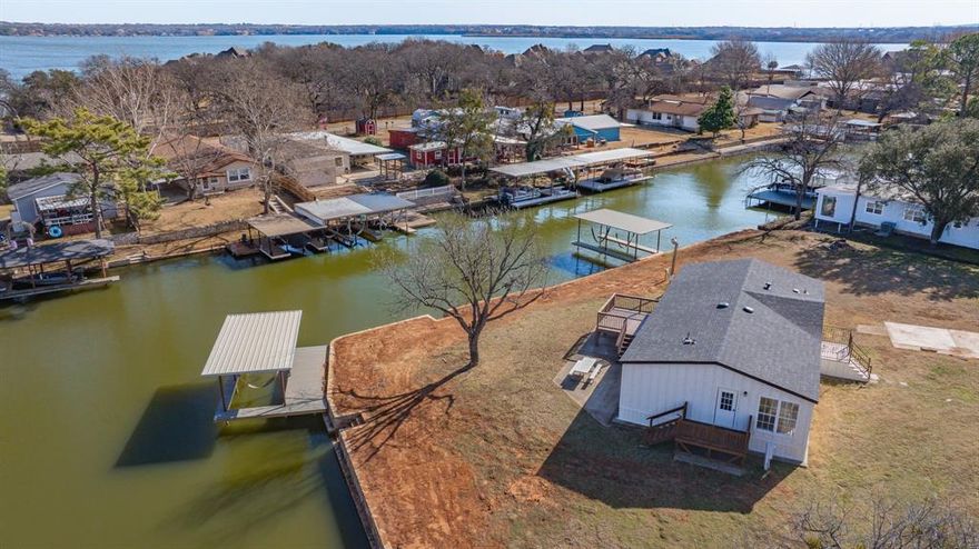 Priced to sell, this fully updated lakefront home is truly move-in ready.
Recent improvements include a new HVAC system, roof, siding, flooring, paint, boat docks, and more. Enjoy expansive 180-degree lake views from the back porch and an oversized lot that offers ample space for outdoor living, entertaining, or simply relaxing by the water. Whether you’re spending time on the lake, hosting friends, or enjoying peaceful sunsets, this property is well suited for both everyday living and weekend getaways. Turnkey and thoughtfully updated, it’s an excellent opportunity to enjoy lake life without the hassle of renovations.