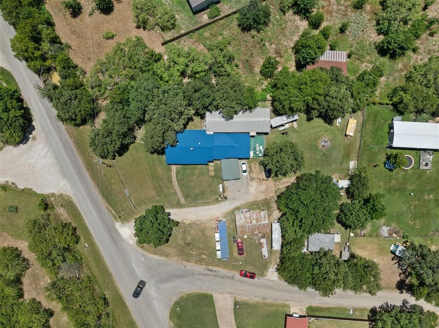 Hard corner out of the city limits! This is a prime spot for making the existing house and buildings into office space for a car lot or outdoor storage space business! 186' of road frontage on County Road 527 and 203' of road frontage on Renfro for a total of .898 acres! Bring your checkbook and imagination to this one!