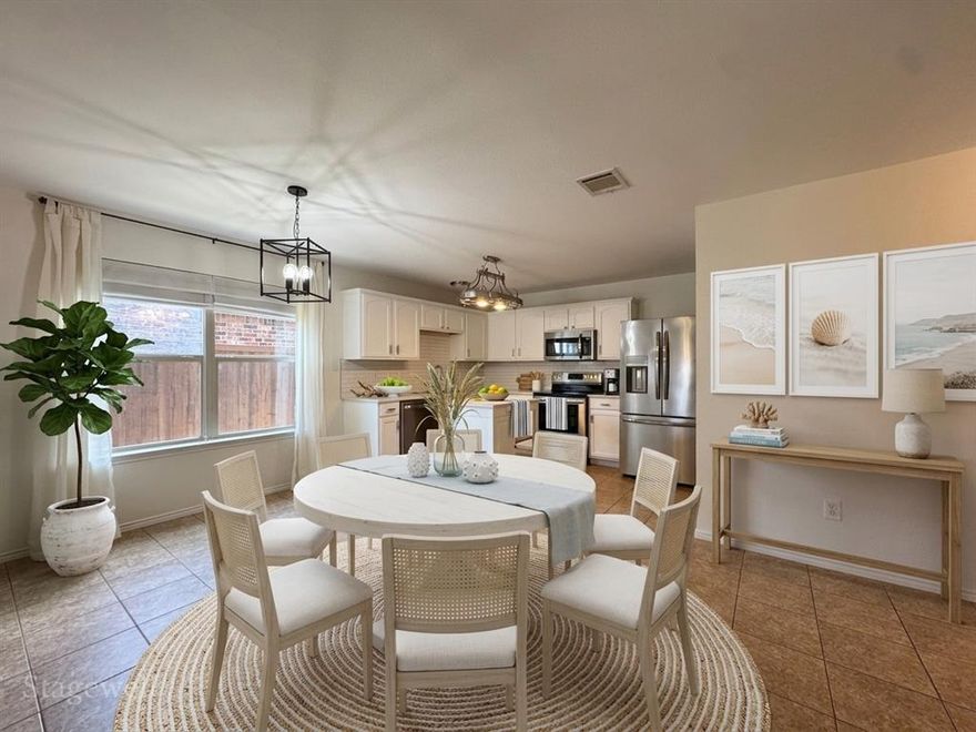 $5,000 in Buyer Closing Costs with good offer!  Cozy and well maintained home in family friendly community with an abundance of amenities just 25 minutes from downtown Dallas.  Feel all the warmth of this 3 bed 2 bath home the moment you walk in with the open concept kitchen and dining area that blends seamlessly into the warm and inviting living room.  Kitchen boasts of white traditional style cabinets, white ceramic subway tile, island for prepping meals, and a French door style refrigerator that conveys with the home. Luxury vinyl plank floors in the living area, new wood fence in the backyard, and new roof are a few of the items that show just how impeccably kept this gorgeous home is.  Enjoy all the wonderful community amenities that include pools with water slides, playgrounds, fitness center, walking trails, and ponds just to name a few.