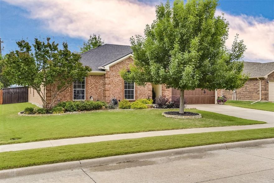 This isn’t just another 4-bedroom home in Waxahachie — it’s the kind of home that makes everyday life flow easier. From the moment you step inside, natural light stretches across the open living space, highlighting a floor plan that was designed to bring people together. The open-concept kitchen, living, and dining area feels generous without being overwhelming — anchored by a fireplace that gives the room warmth and presence. The kitchen is truly the heart of this home — a large island for gathering, impressive counter space for meal prep, and plenty of cabinetry to keep everything organized. It’s functional, comfortable, and ready for busy mornings or weekend hosting. With a split bedroom arrangement, the primary suite feels tucked away and private, while three additional bedrooms offer flexibility for family, guests, or a home office. Low-maintenance laminate flooring keeps the home practical for real life or pets. Step outside and you’ll understand why this one feels complete — a covered back porch, fenced yard, and landscaping that shows real pride of ownership. It’s the kind of backyard where evenings last a little longer. And location matters. Located within walking distance to Felty Elementary & Howard Jr High, and the Waxahachie Sports Complex means quick access to games, trails, playgrounds, and community events — plus convenient proximity to shopping, dining, & healthcare. Recently painted exterior. If you’re searching for a move-in ready home in Waxahachie with space, natural light, thoughtful upgrades, and a layout that truly works — 326 Sagebrush delivers.