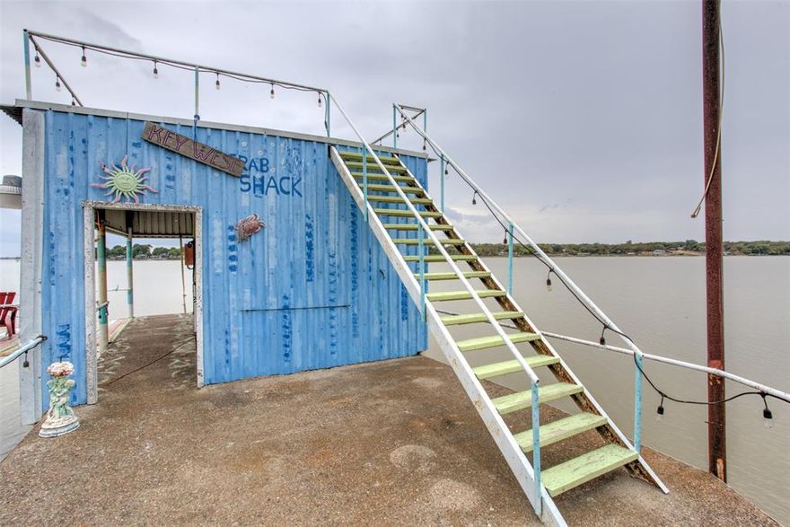 North end of Eagle Mountain Lake home with great water views for miles creating a 'Peaceful Easy Feeling'!. Next door lot and boat ramp included in sale for 94' of waterfront. Totally remodeled home. The 'morning sun pours in like butterscotch and sticks to all your senses'. The current owner has added some extra living space. Could be a nice rental property, short term or long. House is approximately 2000 sqft., 4 bedrooms and 3 baths. The dock and upper deck are the places to be for pure water vibes. Can still enjoy boating! Less than 10 minutes to Hwy. 287. A nice bonus is this is the least expensive property tax rate of the 7 property tax rates on the whole lake. This full time EML realtor was taught to ski in front of this home in the 1967 summer season. The lake is just as majestical now but with more amenities that benefit this area.  A couple of minutes away is one of only 2 free boat ramps on the whole lake for friends when they want to bring their boats. Many fishermen say this is the best fishing area on EML. The lakeside porch presence is just what the doctor ordered! This lake property is a '10' on the Fun Meter. What's not To Like. Come explore for Additional Benefits Hidden In Plain Sight! YOU WILL AGREE THAT TIME WASTED AT THE LAKE IS TIME WELL SPENT!