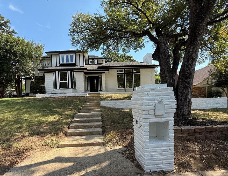 Step inside this newly remodeled 4 br, 3 bath, 2 car garage  with timeless updates.  All the work has been done - LVP throughout downstairs leading up to 2nd floor landing; carpet in upstairs bedrooms, porcelain tile throughout bathrooms, 6 inch baseboards, all new doors, custom cabinets throughout - kitchen, laundry, bathrooms; windows installed July of 2025, new deck at back of home - perfect for enjoying your morning coffee and watching the birds. The main living area features a beautiful fireplace with floor to ceiling quartz surround, painted picture frame paneling creating a cozy atmosphere, and soaring ceilings.  The office that is opposite the living area features a bay window and ceiling fan.  Kitchen comes equipped with custom cabinets, quartz counters, backsplash and breakfast bar, SS appliances, built in pantry which leads to breakfast nook with 2 window seats.  Second living area could be flex space - den, formal dining or kids playroom.  Master bedroom is upstairs with spa like ensuite bath - custom cabinets, quartz counters, soaking tub and beautiful walk in shower.  Two additional bedrooms are upstairs as well featuring a jack & jill bath - custom cabinets, quartz counters, custom tile surrounding bathtub.  4th bedroom is downstairs with full bath located directly across the hallway.  Come and make this your forever home!