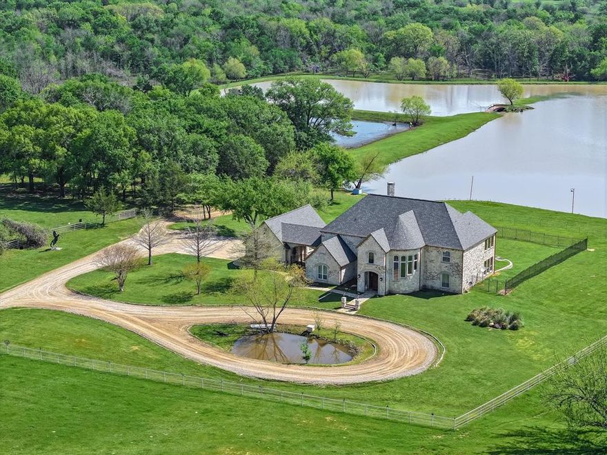 Welcome to a truly magnificent East Texas ranch offering a rare combination of luxury living, premier recreational opportunities, and productive land. Spanning approximately 436 picturesque acres, this exceptional property is anchored by a stunning 4,539 SF custom home perched above a serene 13-acre private fishing lake. Crafted with impeccable quality and attention to detail, the residence showcases marble flooring, granite countertops, and stainless steel appliances, all seamlessly integrated into an open-concept living area designed for both comfort and entertaining. Expansive rooms throughout the home offer natural light and unobstructed views of the ranch. The upstairs office provides a quiet retreat with panoramic views overlooking the lake and rolling pastures beyond. This ranch is ideally suited for both agricultural and recreational pursuits. Approximately 300 acres are devoted to improved pastures for grazing, while 193 acres of mature hardwood timber provide a haven for deer, hogs, and other native wildlife—perfect for hunting or nature exploration.
Infrastructure on the property includes multiple barns for equipment and hay storage, workshops, and a remarkable 7,000+ SF metal building complete with a caretaker’s apartment. A network of well-maintained trails winds throughout the property, making it easily navigable by ATV or horseback. Numerous ponds are scattered across the land, supporting both livestock and wildlife. With over 9,000 feet of frontage on a State Highway, the ranch is easily accessible and offers significant long-term value. Whether you're looking for a private luxury retreat, a working cattle operation, or a hunting and recreational paradise, this East Texas gem offers it all in one extraordinary package.