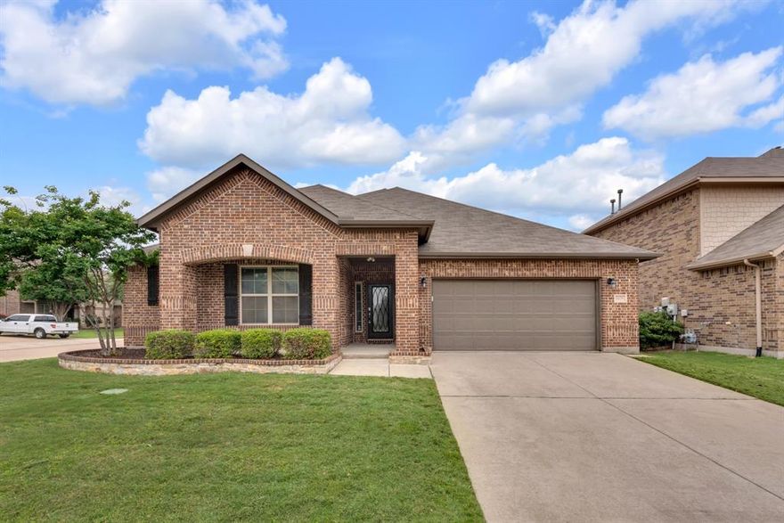 Ideally positioned within the highly sought-after Willow Ridge Estates community in Haslet - a picturesque enclave known for lush, mature landscaping, top-rated schools within walking distance, and a centrally located setting - this stunning residence is gracefully set on a spacious corner lot and offers nearly 2,400 square feet of thoughtfully curated single-story living. From the moment you step inside, you’re welcomed by a light-filled, flowing layout where timeless architectural details take center stage - elegant millwork, graceful arches, art niches, and soaring ceilings are complemented by an abundance of windows that bathe the home in natural light, creating an inviting, refined ambiance throughout. At the heart of the home, the chef’s kitchen is designed for everyday living and entertaining, featuring a gas cooktop, expansive island, and seamless flow into the living area, breakfast nook, and dining space - creating a natural gathering place for intimate family moments and lively celebrations alike. The luxurious primary suite offers a true private retreat, thoughtfully designed for rest and relaxation, complete with a spa-inspired bath featuring dual vanities, a soaking tub, a frameless glass shower, and a spacious walk-in closet. In addition to two generously sized secondary bedrooms, the home features a versatile flex space behind a french door - ideal as a home office, playroom, or second living area. Step outside to your own backyard oasis, where a spacious patio and firepit set the stage for cozy evenings under the stars. With room to add a pool or enjoy the added privacy, the outdoor space is as functional as it is serene. Just beyond your doorstep, enjoy access to beautifully maintained parks, playgrounds, and a resort-style community pool. Ideally located minutes from Highway 287, Alliance Town Center, H-E-B, and a wide array of shopping and dining options, this home perfectly blends comfort, style, and convenience in one exceptional offering.