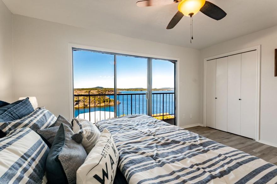 NEWLY REMODELED, 40ft BOAT SLIP, COVERED ATV PARKING. Million dollar views! Next door to FULL SERVICE MARINA. Full remodel, tags still on the furniture. See the lake from every corner of this unit. Experience lakefront living in this charming townhome! The upstairs master suite offers privacy and comfort with incredible lake views. Open-concept living room with big views, kitchen, and dining areas flow seamlessly, complemented by a half bath downstairs for guests. Tons of sleeping in the guest room with full bathroom upstairs. Step out onto the lower deck to grill out and take in the breathtaking lake views. Enjoy the privacy of the upper master deck. 

Sportsman's World has top-notch amenities, including two pools, three tennis courts, two playgrounds, and even an airstrip. With ample parking and a private covered carport.