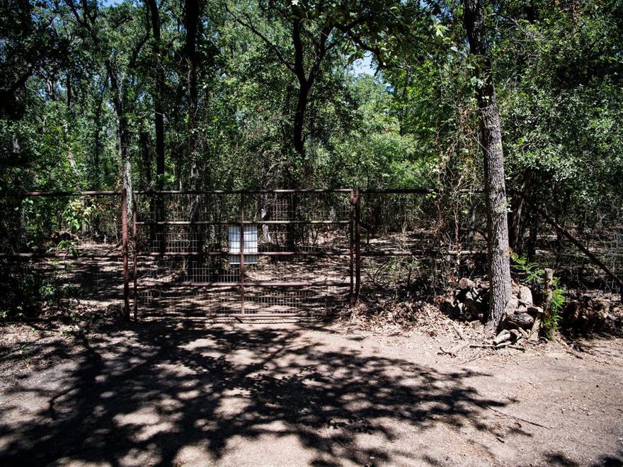 Discover a rare opportunity to own 24 acres of pristine wooded land, graced with majestic mature trees and tranquil scenic trails. Stroll through the natural beauty while enjoying peaceful views that create the perfect country escape—yet remain just minutes from major highways, airports, fine dining, and shopping.

This prime location offers incredible investment potential, ideal for future expansion or multiple development possibilities, each with unique opportunities. For those seeking a truly extraordinary lifestyle, this parcel can also be paired with a stunning custom Southwestern-style smart home on the adjoining property (MLS# 21060078) with attractive savings.