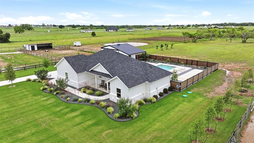 Experience the perfect blend of modern luxury and rural tranquility in this stunning one-story home nestled on two acres in Poolville Texas!

Surrounded by expansive, exquisite ranches and large family-owned parcels, this property offers privacy while maintaining an intimate, manageable feel. The property showcases a modern sparkling pool and a drive through workshop.

The exterior of the home is meticulously maintained, featuring flowering Texas native landscaping throughout, an oversized front yard blanketed in premium Tif Tuf Bermuda grass which is supported by a ten-zone sprinkler system.  

While the immediate grounds feel like a private resort, there is still plenty of land for those looking to embrace the equestrian lifestyle with ample room for horses or other animals and is in close proximity to several Equestrian spas.

The home itself is supported by a high-end infrastructure, including a dedicated water softener and filtration system for the well, ensuring every modern comfort is met in this serene country setting.