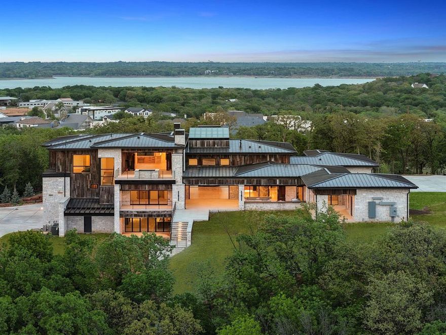 Rising above the forest canopy on nearly nine secluded acres, Summit of Southlake commands the highest elevation in the Dallas–Fort Worth region - an extraordinary vantage point where architecture and nature exist in harmony. Designed by Heritage Design Studio, built by Elite Design Homes, and refined by MOSS Interior, this residence represents the pinnacle of modern Texas luxury.

Beyond the treeline, more than 12,000 square feet of intentional living unfolds in a seamless blend of desert contemporary architecture and timeless detail. The six-bedroom layout, including a private casita, was designed for both entertaining and retreat - featuring a grand great room filled with natural light, a covered terrace with motorized screens and outdoor kitchen, a plunge pool off the primary balcony, a walk-out basement with speakeasy and theater, and a discreet safe room, all finished with a seven-car garage that unites utility and sophistication. The property’s nearly nine acres are eligible for an agricultural exemption, offering long-term tax advantages and enduring value.

Just minutes from DFW International Airport, Southlake Town Square, and the area’s premier dining and schools (open enrollment to Southlake Carroll ISD), Summit of Southlake offers a rare combination of privacy and proximity. With panoramic treetop views, unmatched craftsmanship, and a setting unlike any other in North Texas, Summit of Southlake is more than a home - it’s a legacy estate for those who value elevation, artistry, and privacy at the highest level.