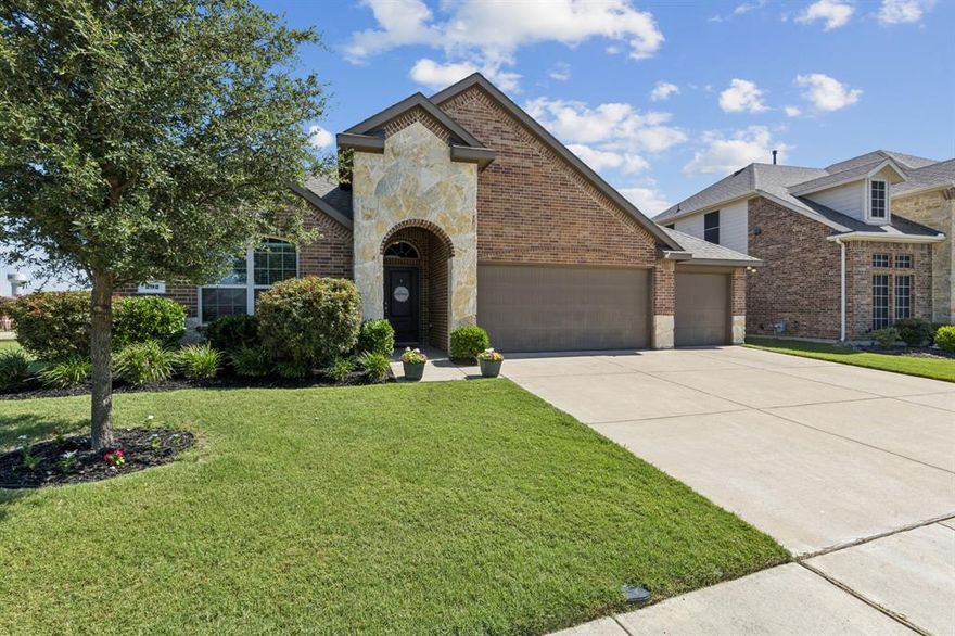 3 car garage! Former Model Home on HUGE Corner Lot in Fate, Texas! Welcome to this beautifully maintained 4-bedroom, 2-bathroom former model home, ideally situated on an expansive corner lot with no homes behind or on one side—offering rare privacy and tranquil greenspace views from the front yard. Step inside through elegant arched entryways into a light-filled home featuring easy-to-maintain flooring in the main living areas. Thoughtful upgrades throughout for everyday living and entertaining.The heart of the home boasts an open layout perfect for gatherings. Kitchen features granite, gas cooktop, a walk in pantry and dual dining areas. The spacious primary suite is a true retreat, complete with a luxurious walk-in closet, dual vanities, and a tile surround shower. Enjoy low-maintenance living with a brick back fence maintained by the HOA, plus mature landscaping that adds curb appeal. The enormous, level backyard is a blank canvas ready for your dream outdoor oasis—plenty of room for a pool, garden, or custom landscaping! A decked attic offers bonus storage space, and the rare 3-car garage provides room for all your tools, toys, or hobbies.The community features resort-style pools, a fitness center, and a stunning clubhouse, and you’re just feet away from a top-rated Rockwall ISD school. With abundant natural light, this home is perfect for indoor plant lovers and anyone seeking a bright, cheerful space to call home. Don't miss this rare opportunity—homes like this don’t come around often!
