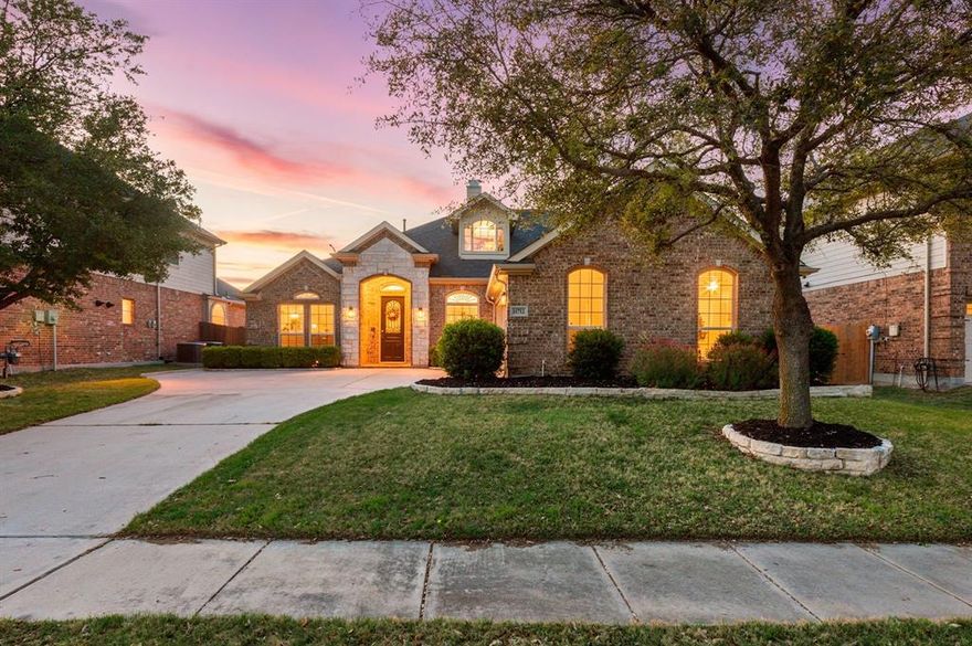 Welcome to this beautifully designed 1.5-story home in Keller ISD, tucked on a quiet cul-de-sac with no rear neighbors and a nearby water feature. Enjoy peace and privacy while still being conveniently located near Keller and Alliance.

From the moment you arrive, the charming brick elevation and inviting entry set the tone for what awaits inside. Step through the front door to soaring ceilings, rich wood flooring, and abundant natural light that highlights the home’s spacious and thoughtfully designed layout.

The main living area features a cozy gas fireplace and seamlessly connects to the kitchen and breakfast nook, creating the perfect space for everyday living and entertaining. The kitchen offers granite countertops, ample cabinetry, a large island, and dual ovens ideal for hosting. An oversized pantry and abundant storage throughout add to the thoughtful design.

This flexible floor plan offers versatility where you need it most. A private office with glass French doors can function as a fourth bedroom, while the formal dining room can serve as an additional living area or office.

The primary suite is set apart for privacy and includes separate vanities, a soaking tub, walk-in shower, and generous closet. All secondary bedrooms are downstairs, while the upstairs media room wired for surround sound with theater lighting provides the perfect retreat.

Enjoy a spacious covered patio with fans and gas hookup for grilling. Located in The Villages of Woodland Springs with trails, pools, playgrounds, and nearby walking paths, fountain, urban fishing, and sand volleyball, this home offers comfort, convenience, and lifestyle.