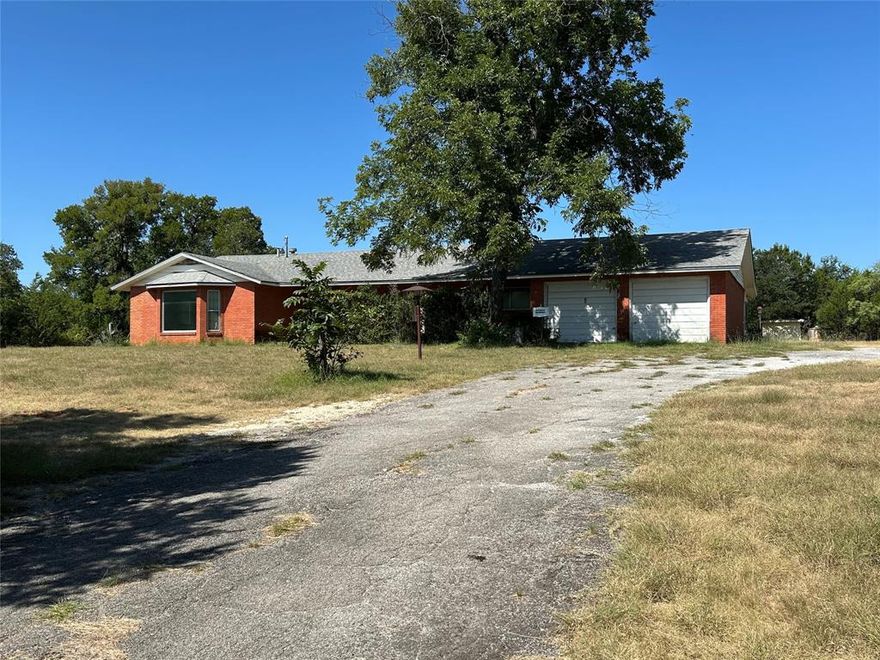 Diamond in the Rough! Full of potential in an A+ location. If you're a hunter or just like to make money, this is one you need to see. 84+- acres Spectacular views. Anyone with a vision can mentally see the showplace this could be.  The nearly 2800 sf 3-3 brick home was custom built, top of the line back in 1968 when it was built, perched on hillside overlooking Iredell to the southwest. The home has been vacant for over a decade and is in remarkable shape considering. The bones and structure are good but it would need complete renovation. The well, home, pool, everything. If you're a HUNTER this has been a deer and wildlife sanctuary for the last several years as no one has been there to disturb them. The home could easily be made into a great hunting lodge. If you're an investor, this one has the potential to be highly profitable once you've done the work. Someone willing to do the sweat equity of cleaning up and remodeling, here is the one you dream of. Property sits off of FM 927 on a very nice chip and seal county road. This is in the area to the East of Iredell where the big ranches begin. The ranch needs clean up, brush and weed control. Interior fences are poor; 2 sides of perimeter are good and 2 are poor. This place would not be a project for the weak hearted but can be that dream place for the strong willed and determined. Most of the 2 fields that still have coastal, it is thigh high. You don't have to wonder what these fields could look like. All you have to do is look across the fence. This place has excellent sandy loam soil. The years untended coastal fields, tell that tale. 
THIS PLACE IS SELLING AS IS. NO REPAIRS AND OR CLEAN UP WILL BE CONSIDERED OR DONE BY SELLERS, POTENTIAL BUYERS SHOULD ASSESS PURCHASE WITH THAT IN MIND. ELECTRICITY IN HOME IS WORKING BUT NOT GUARANTEED! ROOM SIZES, SQUARE FOOTAGE AND TAXES SHOULD BE VERIFIED BY BUYER.