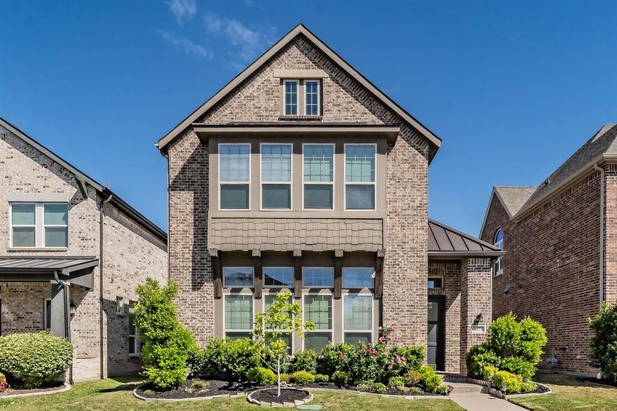 Welcome to this stunning two-story Ashton Woods home, where modern design meets everyday functionality in the highly sought-after University Place community. Thoughtfully designed with an open-concept layout, the main living area seamlessly connects the spacious living room and kitchen, perfect for entertaining or relaxing at home. The kitchen boasts expansive quartz countertops, a generous amount of cabinetry, and ample prep space for any home chef. The primary suite is conveniently located on the first floor, offering a private retreat complete with an oversized soaking tub, separate shower, and easy access to the utility room. Soaring vaulted ceilings enhance the sense of space and natural light throughout the main level.
Upstairs, you’ll find additional bedrooms, each featuring ensuite bathrooms and walk-in closets, providing comfort and privacy for family or guests. A large second living area or den offers flexibility for a media room, game space, or home office. Outside, enjoy a low-maintenance yard ideal for busy lifestyles. Residents of University Place have access to incredible amenities including resort-style swimming pools, a fitness center, office or workspaces, greenbelts, playgrounds, dog parks, and vibrant community events. Conveniently located near schools, shopping, dining, and major highways including the Dallas North Tollway, President George Bush Turnpike, and US-75, plus close proximity to Central Market—this home truly has it all.