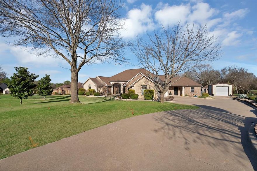 **NO CITY TAX & NO HOA**  **2 NEW REFRIGERATORS AND WASHER AND DRYER COME WITH** True Custom home sits on a beautifully landscaped one-acre property, thoughtfully designed to support multi-generational living, home-based businesses, and flexible lifestyles. Surrounded by mature trees and a peaceful creek along the back, the setting offers privacy and a quiet retreat while still providing convenient access to nearby shopping, dining, and everyday essentials. The layout offers excellent versatility, with a separate entrance ideal for a private home office, client-facing business, studio, or independent living space, perfect for extended family, guests, or work-from-home professionals seeking separation from the main living areas. Recent updates include the kitchen that was updated in 2025 with quartz countertops, modern lighting, and updated GE appliances including a new gas range, dishwasher, and trash compactor. Additional features include an LG refrigerator and an LG combination microwave-convection-steam oven installed in 2022, creating a well-equipped central hub for shared living. The primary bathroom renovation, completed in 2024, showcases updated tile and quartz countertops. In 2025, LVP flooring was installed throughout the main living areas and hallways, complemented by fresh interior paint and new carpet in all bedrooms providing a move-in ready experience for households of all sizes. Energy efficiency is a major benefit, with OWNED & PAID OFF solar panels that CONVEY with the property, offering long-term savings and sustainability with the current owners averaging $236 a month for utility costs. A Samsung washer and dryer set, along with a secondary Whirlpool refrigerator, will also convey, adding further convenience for multi-generational use. Additional highlights include NO HOA and NO CITY TAX giving you greater flexibility and fewer restrictions for those running a business from home or accommodating extended family needs.
