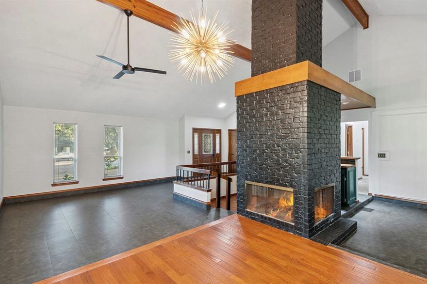 Welcome Home to 1308 Clubhouse Court, a truly distinctive golf course residence nestled in the heart of Walnut Creek Estates, updated with bold, contemporary living spaces. This three bedroom, two bath house blends striking contemporary design with classic architectural charm, offering spacious living in a premier cul-de-sac location. Step inside to discover generous living areas, including two inviting family spaces and oversized bedrooms. At the center of the home, a soaring three sided fireplace rises to meet cathedral ceilings highlighted with original wooden beams. A sunken conversation pit and a classic wet bar frame the fireplace, creating a one-of-a-kind entertaining experience. The kitchen has been thoughtfully updated with a Verona Prestige range with pot filler, sleek new quartz countertops and a modern composite sink and faucet. Situated on nearly a third of an acre, this home offers direct access to the 10th hole of the Pecan Course of the Walnut Creek Country Club--a rare find for golf enthusiasts. Families will also appreciate being zoned to top-rated schools in the highly sought-after Mansfield ISD.