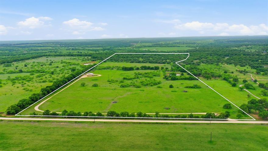 70± Acres Near Gorman, TX – Turnkey Barndo, shop, RV setup and prime recreational land. Just 6 miles west of Gorman in Eastland County, this 70± acre property delivers the perfect combination of modern barndominium living, functional improvements, and highly usable land. The centerpiece is an 1,800 sq ft insulated metal building featuring a custom-built 720 sq ft apartment, thoughtfully designed for comfort and efficiency. Inside, you’ll find a full kitchen featuring custom pecan live-edge wood countertops and a stainless gas cooktop, along with a spacious bedroom offering a large walk-in closet and a beautifully finished bathroom with a tiled, dual-head shower. Above the apartment is a 720 sq ft loft that provides abundant storage or room to expand. Step outside to a covered porch that can be accessed from the living quarters and shop, creating an ideal setup for relaxing or entertaining. An additional 1,100 sq ft workshop with 2 full sized roll up doors and 1 roll up door for your side by side that adds even more functionality. This property is fully RV-ready with 50-amp service, water, sewer hookup, and a covered space accommodating up to a 50-foot RV—perfect for guests or extended stays. The land is equally impressive, offering a great mix of open ground for hay production or cultivation and wooded areas that provide excellent cover for wildlife, as well as a very hardy, and very drought resistant stock tank that is fully stocked with fish. Deer, hogs, and turkey are abundant, making this an excellent recreational or hunting property. Whether you’re looking for a full-time residence, weekend getaway, or a multi-use ranch with recreational potential, this turnkey property is ready to go.