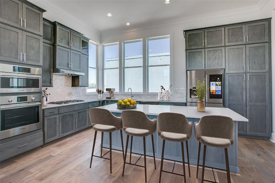 Welcome to Foundry Row, an exclusive collection of 8 townhomes in Fort Worth’s vibrant West 7th District. This elegantly designed END UNIT features an open floorplan with high-end finishes ideal for entertaining. The main level boasts soaring 12-foot ceilings and a 10-foot sliding glass door that seamlessly extends your living space outdoors. The gourmet kitchen is equipped with Bosch stainless steel appliances, quartz countertops, a stylish tile backsplash, and soft-close cabinetry. The serene primary suite includes a large drop-in tub, walk-in shower, and extra spacious closet. Throughout the home, upgraded engineered hardwoods enhance the sophisticated ambiance, while the private rooftop deck offers a quiet retreat with sweeping views of Downtown Fort Worth. Located just minutes from the lively West 7th District, you’ll enjoy convenient access to dining, shopping, museums, entertainment, and more. Experience the perfect blend of luxury and sustainability in this exceptional home. PLEASE GO TO MODEL HOME FOR ALL OPEN HOUSES - 201 CARROLL ST.