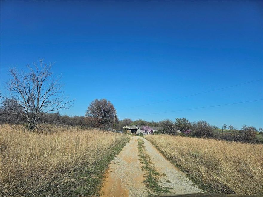 Discover the charm and potential of **9996 Highway 199 in Poolville**, where **10.01 acres of natural Texas beauty** set the stage for your future oasis. The **2432 sq ft doublewide** offers **4 bedrooms and 3 bathrooms**, and while it’s currently lived in as a primary residence, let’s just say it’s ready for someone with vision, grit, and maybe a good toolbelt. The roof needs attention, some floorboards are feeling a little too “soft,” and the kitchen plumbing is politely requesting a makeover. **This is an as-is sale**, and the **value is truly in the land**—wide-open space and a peaceful setting surrounded by well-kept neighboring properties. If you’re open to a project and excited about creating your own slice of paradise, this acreage is calling your name. **Prequalification letter or proof of funds required.** Come walk the land and imagine what you can build here.