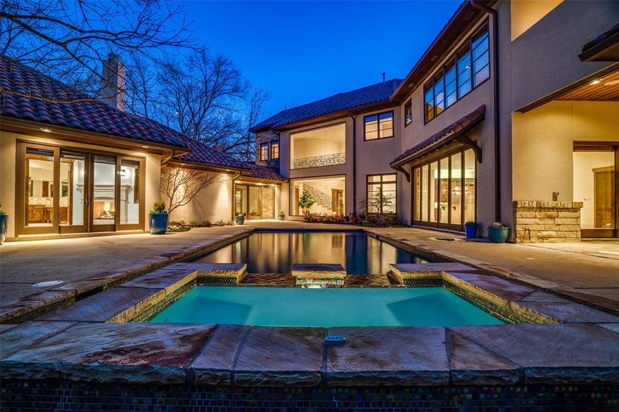 Gated luxurious estate combines the beauty & lifestyle of a Wine Country Vacation w easy access to the bustling metroplex of Dallas-Fort Worth. You will want to staycation all year round & enjoy the luxury of everything at your home. Almost .5 acre, in exclusive Green Park, this home is only 1 of nine, so much quality living indoors & out.  Approaching, you are welcomed into a beautiful courtyard, perfect for coffee or a cocktail. Wonderful for entertaining, you immediately notice the attention to architectural detail & impeccable quality in workmanship & design.  Grand foyer, big ensuite bedrooms, enormous master closets, floor to ceiling windows & huge sliding glass doors, reflect noteworthy attention to detail by builder, Ronny Anderson.  The chef's kitchen w high end appliances has views of the beautiful pool, outdoor living areas & mature trees.  End the day enjoying the separate amazing outdoor spa, relax by the waterfall, and soak after your long day of Wine Country living.