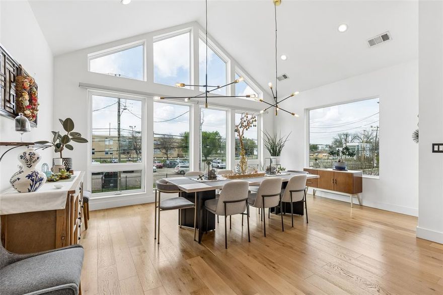 Stunning single-family attached home in the heart of East Uptown just moments from The Central, one of the city’s most transformative new mixed-use developments. Ultimate lock and leave with a private pool! Designed for elevated living and sophisticated entertaining, this two story townhome features dramatic soaring ceilings in the main living area, with floor to ceiling windows, genuine hardwood floors, and museum finished walls. The refined look is enhanced by electronic filtered blinds, custom lighting and curated architectural details. The state-of-the-art kitchen anchors the home with a striking Quartz waterfall island, stainless steel appliances, gas range, double ovens, custom wood accents, and sleek contemporary fixtures, blending form and function. The first level features two ample sized bedrooms ideally suited as offices, media or guest rooms and an expansive primary suite which overlooks the private, resort-style pool. The spa-inspired primary bath showcases an open-concept wet room design with a freestanding soaking tub, elevated shower features, and custom motion-activated lighting. Custom closets, a well designed laundry room and a dual HVAC systems provide optimal efficiency and comfort year-round. Impressive outdoor living features a private balcony off the living room which overlooks the custom-built pool and features a slate fireplace - seamless extension of the interior living space. The beautiful heated and chilled pool is finished with opalescent tile and a waterfall feature, delivering year-round enjoyment and a boutique-hotel ambiance rarely found in Uptown townhomes. Additional highlights include an attached two-car garage with epoxy-coated flooring and upgraded storage systems. A rare opportunity to own a one-of-a-kind luxury townhome with private pool in East Uptown, located in a rapidly appreciating neighborhood. Meticulously designed, architecturally striking and no detail overlooked!