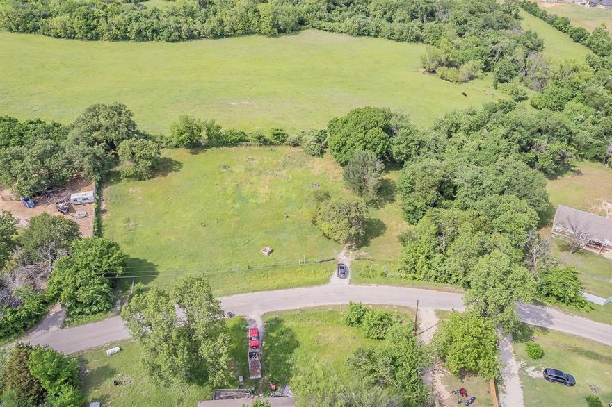 Build your dream home on this 1.56-acre double lot in the peaceful Briar Oaks Ranchett community. Enjoy country living with no HOA, light restrictions, and plenty of space for a home, workshop, pool, or outdoor entertainment living. Close to Eagle Mountain Lake, great schools, and shopping, with easy access to Azle and Fort Worth. This land is a great spot to create your ideal Texas retreat.